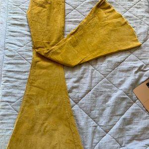 Yellow  corduroy bell bottoms
Size 4, brand new, small boutique